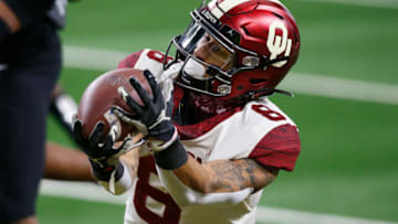 Dec 19, 2020; Arlington, Texas, USA; Oklahoma Sooners wide receiver Trejan Bridges (8) cannot catch a pass in the third quarter against the Iowa State Cyclones at AT&T Stadium. Mandatory Credit: Tim Heitman-USA TODAY Sports