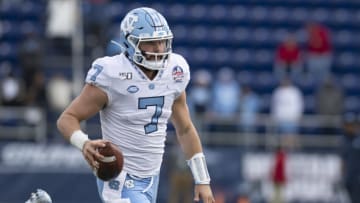 Dec 27, 2019; Annapolis, Maryland, USA; North Carolina Tar Heels quarterback Sam Howell (7) runs during the fourth quarter against the North Carolina Tar Heels at Navy-Marine Corps Memorial Stadium. Mandatory Credit: Tommy Gilligan-USA TODAY Sports