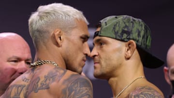 LAS VEGAS, NEVADA - DECEMBER 10: Charles Oliveira of Brazil and Dustin Poirier face off during the UFC 269 ceremonial weigh-in at MGM Grand Garden Arena on December 10, 2021 in Las Vegas, Nevada. (Photo by Carmen Mandato/Getty Images)