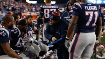 Jan 16, 2016; Foxborough, MA, USA;New England Patriots offensive line coach Dave DeGuglielmo talks to his players as they take on the Kansas City Chiefs during the second half in a AFC Divisional round playoff game at Gillette Stadium. Mandatory Credit: David Butler II-USA TODAY Sports