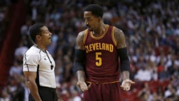 Dec 5, 2015; Miami, FL, USA; NBA referee Bill Kennedy (left) talks with Cleveland Cavaliers guard J.R. Smith (right) during the second half against the Miami Heat at American Airlines Arena. The Heat won 99-84. Mandatory Credit: Steve Mitchell-USA TODAY Sports
