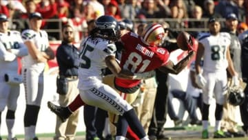 Dec 8, 2013; San Francisco, CA, USA; San Francisco 49ers wide receiver Anquan Boldin (81) makes a catch next to Seattle Seahawks cornerback Richard Sherman (25) in the second quarter at Candlestick Park. Mandatory Credit: Cary Edmondson-USA TODAY Sports