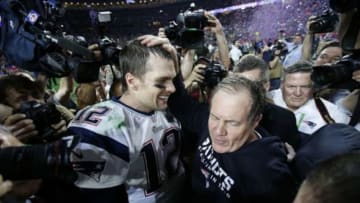 Feb 1, 2015; Glendale, AZ, USA; New England Patriots head coach Bill Belichick (right) celebrates with quarterback Tom Brady (12) after defeating the Seattle Seahawks in Super Bowl XLIX at University of Phoenix Stadium. Mandatory Credit: Mark J. Rebilas-USA TODAY Sports