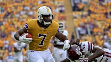 Sep 17, 2016; Baton Rouge, LA, USA; LSU Tigers running back Leonard Fournette (7) is defended by Mississippi State Bulldogs defensive back Lashard Durr (25) during the first quarter of a game at Tiger Stadium. Mandatory Credit: Derick E. Hingle-USA TODAY Sports