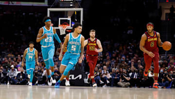 CLEVELAND, OH - OCTOBER 22: Lamar Stevens #8 of the Cleveland Cavaliers brings the ball down court chased by James Bouknight #5 of the Charlotte Hornets and Kai Jones #23 of the Charlotte Hornets in the second half at Rocket Mortgage Fieldhouse on October 22, 2021 in Cleveland, Ohio. NOTE TO USER: User expressly acknowledges and agrees that, by downloading and or using this photograph, User is consenting to the terms and conditions of the Getty Images License Agreement. (Photo by Rick Osentoski/Getty Images)