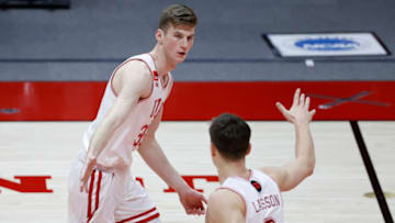 Feb 27, 2021; Salt Lake City, Utah, USA; Utah Utes center Branden Carlson (35) and guard Pelle Larsson (3) reacts in the second half against the USC Trojans at Jon M. Huntsman Center. Mandatory Credit: Jeffrey Swinger-USA TODAY Sports