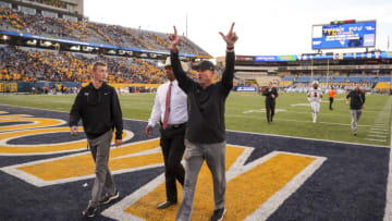 Oct 2, 2021; Morgantown, West Virginia, USA; Texas Tech Red Raiders head coach Matt Wells celebrates after defeating the West Virginia Mountaineers at Mountaineer Field at Milan Puskar Stadium. Mandatory Credit: Ben Queen-USA TODAY Sports