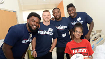 BOSTON, MA - JUNE 20: New England Patriot's rookies (L to R) Ja'Whaun Bentley, Braxton Berrios, Duke Dawson, and Christian Sam visit Kayah at Boston Children's Hospital June 20, 2018 in Boston, Massachusetts. (Photo by Darren McCollester/Getty Images for Boston Children's Hospital)