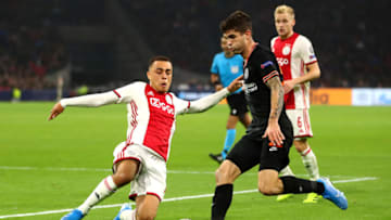AMSTERDAM, NETHERLANDS - OCTOBER 23: Sergino Dest of Ajax tackles Christian Pulisic of Chelsea during the UEFA Champions League group H match between AFC Ajax and Chelsea FC at Amsterdam Arena on October 23, 2019 in Amsterdam, Netherlands. (Photo by Dean Mouhtaropoulos/Getty Images)
