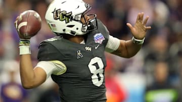 GLENDALE, ARIZONA - JANUARY 01: Quarterback Darriel Mack Jr. #8 of the UCF Knights throws a pass during the third quarter of the PlayStation Fiesta Bowl between LSU and Central Florida at State Farm Stadium on January 01, 2019 in Glendale, Arizona. (Photo by Christian Petersen/Getty Images)