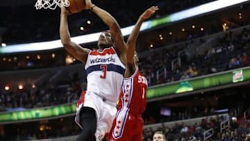 Feb 29, 2016; Washington, DC, USA; Washington Wizards guard Bradley Beal (3) dunks the ball as Philadelphia 76ers guard Ish Smith (1) defends in the third quarter at Verizon Center. The Wizards won 116-108. Mandatory Credit: Geoff Burke-USA TODAY Sports