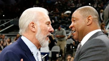 SAN ANTONIO,TX - APRIL 8: Head coach Gregg Popovich of the San Antonio Spurs greets head coach Doc Rivers of the Los Angeles Clippers before the start of the game at AT