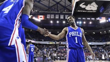 December 30, 2015; Sacramento, CA, USA; Philadelphia 76ers guard Ish Smith (1) celebrates with forward Nerlens Noel (4) during the fourth quarter against the Sacramento Kings at Sleep Train Arena. The 76ers defeated the Kings 110-105. Mandatory Credit: Kyle Terada-USA TODAY Sports