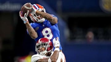 Dec 19, 2020; Atlanta, Georgia, USA; Florida Gators wide receiver Trevon Grimes (8) catches a touchdown against Alabama Crimson Tide running back Keilan Robinson (2) during the third quarter in the SEC Championship at Mercedes-Benz Stadium. Mandatory Credit: Dale Zanine-USA TODAY Sports