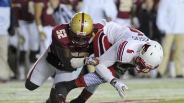 Nov 8, 2014; Boston, MA, USA; Boston College Eagles linebacker Steven Daniels (52) tackles Louisville Cardinals wide receiver Eli Rogers (6) during the first half at Alumni Stadium. Mandatory Credit: Bob DeChiara-USA TODAY Sports
