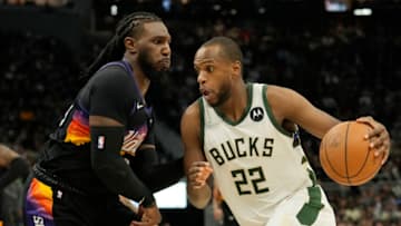 MILWAUKEE, WISCONSIN - MARCH 06: Khris Middleton #22 of the Milwaukee Bucks dribbles the ball against Jae Crowder #99 of the Phoenix Suns during the second half at Fiserv Forum on March 06, 2022 in Milwaukee, Wisconsin. The Milwaukee Bucks defeated the Phoenix Suns 132-122. NOTE TO USER: User expressly acknowledges and agrees that, by downloading and or using this photograph, User is consenting to the terms and conditions of the Getty Images License Agreement. (Photo by Patrick McDermott/Getty Images)