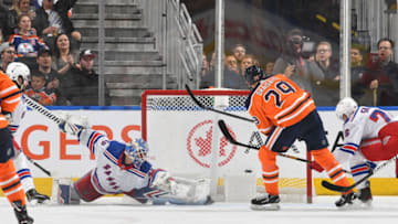 EDMONTON, AB - DECEMBER 31: Leon Draisaitl #29 of the Edmonton Oilers scores on Alexandar Georgiev #40 of the New York Rangers on December 31, 2019, at Rogers Place in Edmonton, Alberta, Canada. (Photo by Andy Devlin/NHLI via Getty Images)