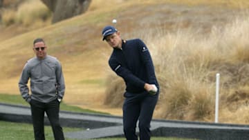 LA QUINTA, CA - JANUARY 16: Justin Rose of England plays a shot, as swing coach Sean Foley looks on prior to the start of the Desert Classic at the Jack Nicklaus Tournament Course at PGA West on January 16, 2019 in La Quinta, California. (Photo by Jeff Gross/Getty Images)