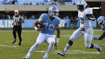 Nov 19, 2016; Chapel Hill, NC, USA; North Carolina Tar Heels quarterback Mitch Trubisky (10) with the ball as Citadel Bulldogs linebacker Myles Pierce (50) defends in the second quarter at Kenan Memorial Stadium. Mandatory Credit: Bob Donnan-USA TODAY Sports