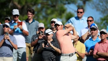 PONTE VEDRA BEACH, FLORIDA - MARCH 11: Rory McIlory of Northern Ireland plays a tee shot as fans look on during a practice round prior to The PLAYERS Championship on The Stadium Course at TPC Sawgrass on March 11, 2020 in Ponte Vedra Beach, Florida. (Photo by Cliff Hawkins/Getty Images)