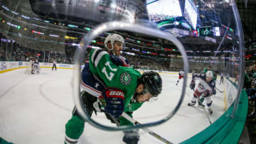 DALLAS, TX - JANUARY 02: Columbus Blue Jackets center Boone Jenner (38) cross checks Dallas Stars center Devin Shore (17) into the boards during the game between the Dallas Stars and the Columbus Blue Jackets on January 02, 2018 at the American Airlines Center in Dallas, Texas. Columbus defeats Dallas 2-1. (Photo by Matthew Pearce/Icon Sportswire via Getty Images)