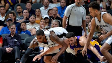 SAN ANTONIO, TX - APRIL 5: LaMarcus Aldridge #12 of the San Antonio Spurs and Larry Nance Jr. #7 of the Los Angeles Lakers chase down a loose ball on April 5, 2017 at the AT&T Center in San Antonio, Texas. NOTE TO USER: User expressly acknowledges and agrees that, by downloading and or using this photograph, user is consenting to the terms and conditions of the Getty Images License Agreement. Mandatory Copyright Notice: Copyright 2017 NBAE (Photos by Mark Sobhani/NBAE via Getty Images)