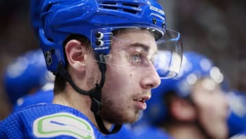 VANCOUVER, BC - OCTOBER 28: Quinn Hughes #43 of the Vancouver Canucks looks on from the bench during their NHL game against the Florida Panthers at Rogers Arena October 28, 2019 in Vancouver, British Columbia, Canada. (Photo by Jeff Vinnick/NHLI via Getty Images)"n