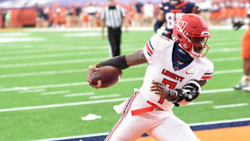 Oct 17, 2020; Syracuse, NY, USA; Liberty Flames quarterback Malik Willis (7) scores on a touchdown run in the first half during a game against Syracuse on Saturday, Oct. 17, 2020, at the Carrier Dome in Syracuse, N.Y. Mandatory Credit: Dennis Nett/Pool Photo-USA TODAY Sports