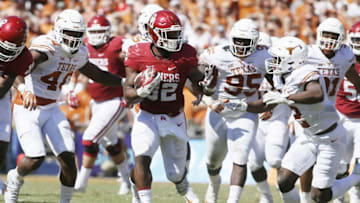 Oct 8, 2016; Dallas, TX, USA; Oklahoma Sooners running back Samaje Perine (32) runs the ball against the Texas Longhorns in the game at Cotton Bowl. Mandatory Credit: Tim Heitman-USA TODAY Sports