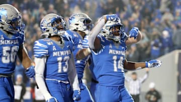 MEMPHIS, TN - DECEMBER 7: Antonio Gibson #14 of the Memphis Tigers celebrates a touchdown with teammates against the Cincinnati Bearcats during the American Athletic Conference Championship game on December 7, 2019 at Liberty Bowl Memorial Stadium in Memphis, Tennessee. Memphis defeated Cincinnati 29-24. (Photo by Joe Murphy/Getty Images)