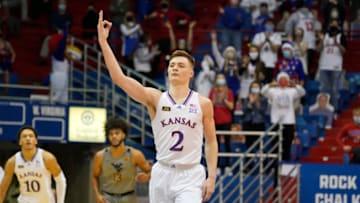 Kansas basketball guard Christian Braun (2) celebrates after scoring a three point basket against the West Virginia. Mandatory Credit: Denny Medley-USA TODAY Sports