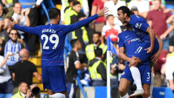 LONDON, ENGLAND - AUGUST 18: Pedro of Chelsea celebrates after scoring his team's first goal with team mates Marcos Alonso and Alvaro Morata during the Premier League match between Chelsea FC and Arsenal FC at Stamford Bridge on August 18, 2018 in London, United Kingdom. (Photo by Mike Hewitt/Getty Images)