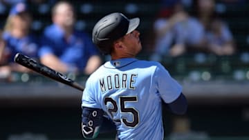 Mar 3, 2021; Mesa, Arizona, USA; Seattle Mariners shortstop Dylan Moore (25) bats against the Chicago Cubs during the first inning of a spring training game at Sloan Park. Mandatory Credit: Joe Camporeale-USA TODAY Sports