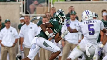 Sep 2, 2016; East Lansing, MI, USA; Michigan State Spartans wide receiver Donnie Corley (9) carries the ball against the Furman Paladins during the first half at Spartan Stadium. Mandatory Credit: Mike Carter-USA TODAY Sports