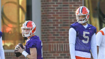Clemson quarterback Cade Klubnik (2) passes near quarterback D.J. Uiagalelei (5) during spring practice on March 2.Clemson Spring Football Practice March 2