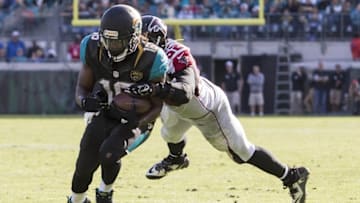 Dec 20, 2015; Jacksonville, FL, USA; Jacksonville Jaguars running back Denard Robinson (16) runs as Atlanta Falcons outside linebacker Justin Durant (52) tackles in the third quarter at EverBank Field. The Atlanta Falcons won 23-17. Mandatory Credit: Logan Bowles-USA TODAY Sports