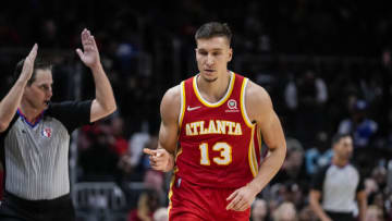 Mar 18, 2022; Atlanta, Georgia, USA; Atlanta Hawks guard Bogdan Bogdanovic (13) reacts after making a three point basket against the Memphis Grizzlies during the second half at State Farm Arena. Mandatory Credit: Dale Zanine-USA TODAY Sports
