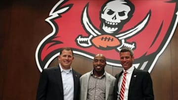 May 9, 2013; Tampa, FL, USA; Tampa Bay Buccaneers cornerback Ronde Barber (middle) poses with head coach Greg Schiano (left) and general manager Mark Dominik during his retirement press conference at One Buccaneer Place. Mandatory Credit: Kim Klement-USA TODAY Sports