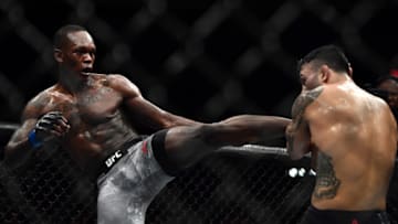LAS VEGAS, NV - JULY 06: (L-R) Israel Adesanya of Nigeria kicks Brad Tavares in their middleweight bout during The Ultimate Fighter Finale event inside The Pearl concert theater at Palms Casino Resort on July 6, 2018 in Las Vegas, Nevada. (Photo by Brandon Magnus/Zuffa LLC/Zuffa LLC via Getty Images)