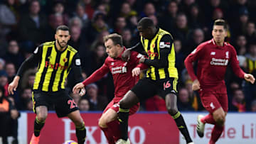 WATFORD, ENGLAND - NOVEMBER 24: Xherdan Shaqiri of Liverpool is challenged by Abdoulaye Doucoure of Watford during the Premier League match between Watford FC and Liverpool FC at Vicarage Road on November 24, 2018 in Watford, United Kingdom. (Photo by Alex Broadway/Getty Images)