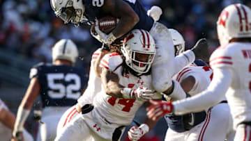 Nov 10, 2018; University Park, PA, USA; Penn State Nittany Lions running back Miles Sanders (24) leaps over Wisconsin Badgers safety D'Cota Dixon (14) during the fourth quarter at Beaver Stadium. Penn State defeated Wisconsin 22-10. Mandatory Credit: Matthew O'Haren-USA TODAY Sports