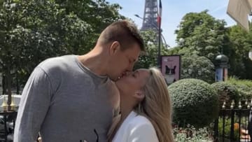 Camille Kostek and Rob Gronkowski in front of the Eiffel Tower in France.