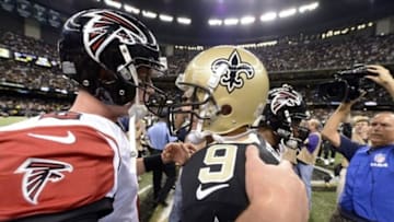 November 11, 2012; New Orleans, LA, USA; Atlanta Falcons quarterback Matt Ryan (2) greets New Orleans Saints quarterback Drew Brees (9) after the Falcons 31-27 loss at the Mercedes-Benz Superdome. Mandatory Credit: John David Mercer-USA TODAY Sports