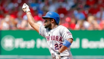 Jun 18, 2014; St. Louis, MO, USA; New York Mets left fielder Eric Young Jr. (22) celebrates on second after hitting a ground rule double during the seventh inning against the St. Louis Cardinals at Busch Stadium. The Mets won 3-2. Mandatory Credit: Scott Kane-USA TODAY Sports