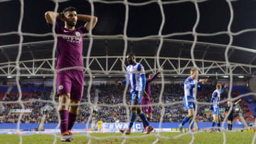 WIGAN, ENGLAND - FEBRUARY 19: Sergio Aguero of Manchester City looks dejected during the Emirates FA Cup Fifth Round match between Wigan Athletic and Manchester City at DW Stadium on February 19, 2018 in Wigan, England. (Photo by Gareth Copley/Getty Images)