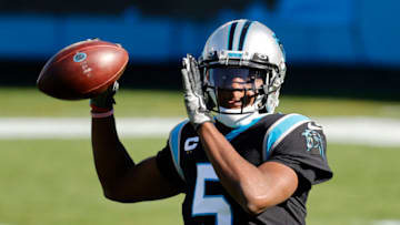 CHARLOTTE, NORTH CAROLINA - DECEMBER 13: Teddy Bridgewater #5 of the Carolina Panthers tosses to stay loose during the first quarter of their game against the Denver Broncos at Bank of America Stadium on December 13, 2020 in Charlotte, North Carolina. (Photo by Jared C. Tilton/Getty Images)