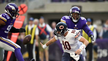 MINNEAPOLIS, MN - DECEMBER 31: Mitchell Trubisky #10 of the Chicago Bears throws the ball away while being pursued by defenders Linval Joseph #98 and Danielle Hunter #99 of the Minnesota Vikings in the second quarter of the game on December 31, 2017 at U.S. Bank Stadium in Minneapolis, Minnesota. the play resulted in a two point safety for the Vikings. (Photo by Hannah Foslien/Getty Images)