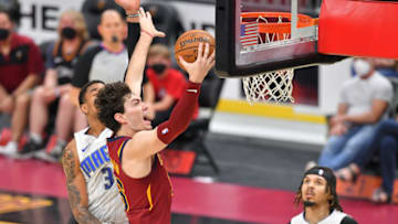 CLEVELAND, OHIO - APRIL 28: Cedi Osman #16 of the Cleveland Cavaliers drives toward the basket past Chuma Okeke #3 of the Orlando Magic during the third quarter at Rocket Mortgage Fieldhouse on April 28, 2021 in Cleveland, Ohio. NOTE TO USER: User expressly acknowledges and agrees that, by downloading and/or using this photograph, user is consenting to the terms and conditions of the Getty Images License Agreement. (Photo by Jason Miller/Getty Images)