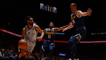 DENVER, CO - APRIL 3: Patty Mills #8 of the San Antonio Spurs handles the ball during the game against Monte Morris #11 of the Denver Nuggets on April 3, 2019 at the Pepsi Center in Denver, Colorado. NOTE TO USER: User expressly acknowledges and agrees that, by downloading and/or using this Photograph, user is consenting to the terms and conditions of the Getty Images License Agreement. Mandatory Copyright Notice: Copyright 2019 NBAE (Photo by Bart Young/NBAE via Getty Images)