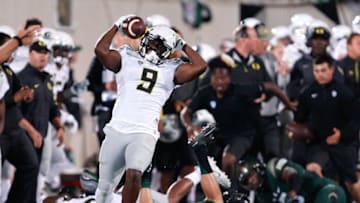 Sep 12, 2015; East Lansing, MI, USA; Oregon Ducks wide receiver Byron Marshall (9) steps out of bounds and raises his arms during the first quarter against the Michigan State Spartans at Spartan Stadium. Spartans beat the Ducks 31-28. Mandatory Credit: Raj Mehta-USA TODAY Sports